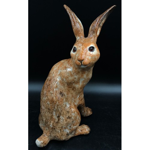 253 - Two Winstanley brown hares, one size 6 the other size 8, both signed to base.