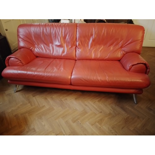 97 - Red leather 1970's sofa with tapering stainless steel legs to front, 83cm h x 200cm l x 95cm w, seat... 