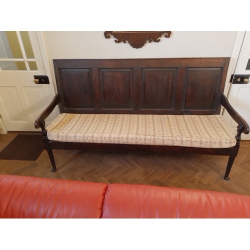 98 - George III Oak Settle with turned legs on pad feet, four panel back cross-banded with mahogany, squa... 