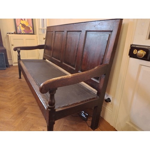 98 - George III Oak Settle with turned legs on pad feet, four panel back cross-banded with mahogany, squa... 