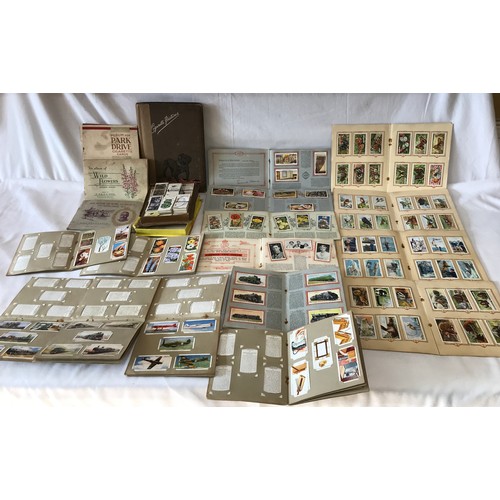 1229 - A large collection of cigarette cards, full sets in 11 Wills and 4 Park Drive card albums to include... 