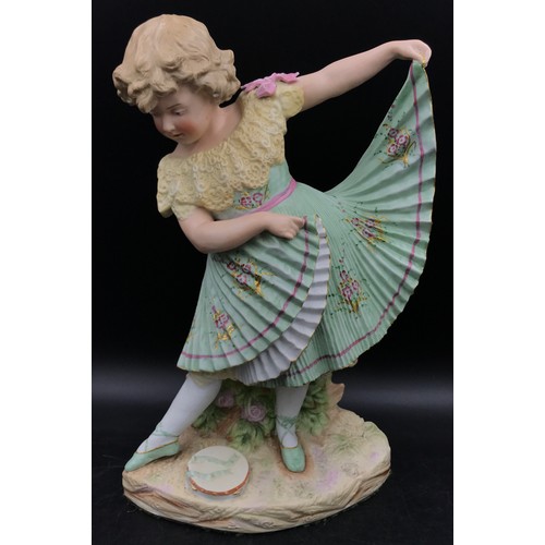 240 - A late 19thC Gebruder Heubach bisque figurine of a girl modelled in a green pleated dress and ballet... 