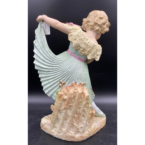 240 - A late 19thC Gebruder Heubach bisque figurine of a girl modelled in a green pleated dress and ballet... 