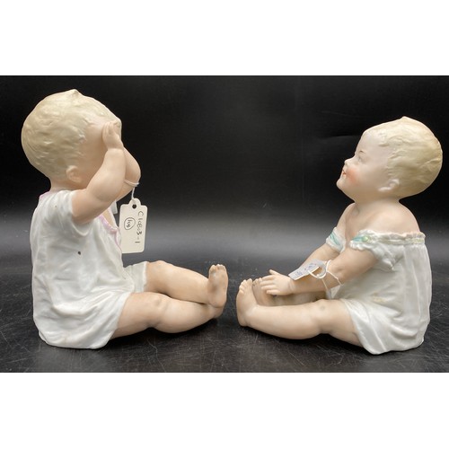 241 - Two Gebruder Heubach piano dolls modelled both seated, one with arms raised 17cm, the other 16cm. Bo... 