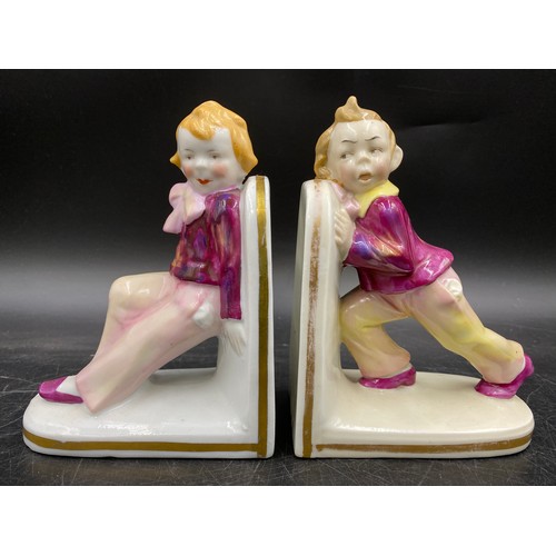 245 - English and Continental porcelain to include a pair of book ends, Royal Albert 'Mrs Tiggy Winkle Tak... 