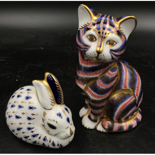 252 - Two Royal Crown Derby animal paperweights a cat 14cm h and a rabbit 8cm h both with gold stoppers.