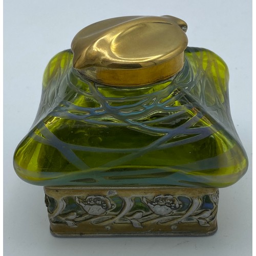 417 - An Art Nouveau inkwell with green iridescent glass and brass hinged cover stamped DRGM 168180 GER103... 