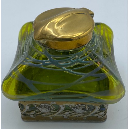 417 - An Art Nouveau inkwell with green iridescent glass and brass hinged cover stamped DRGM 168180 GER103... 