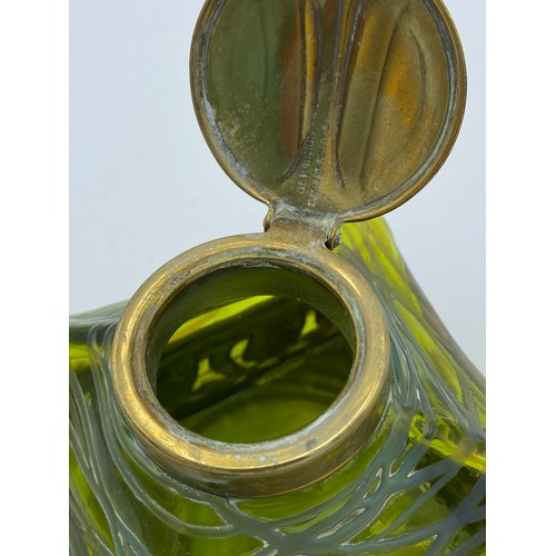 417 - An Art Nouveau inkwell with green iridescent glass and brass hinged cover stamped DRGM 168180 GER103... 