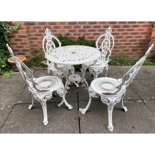 224 - An aluminium garden set comprising round table, 4 chairs and planter. Table 68cm d.