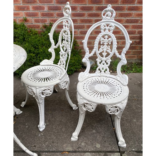 224 - An aluminium garden set comprising round table, 4 chairs and planter. Table 68cm d.