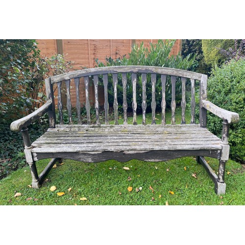 227 - A wooden garden bench. 150 w x 96cm h.