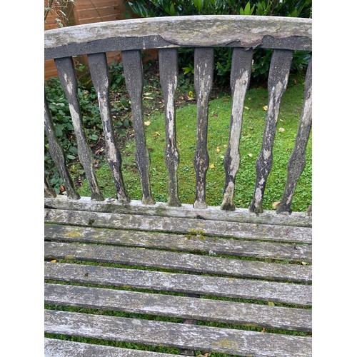 227 - A wooden garden bench. 150 w x 96cm h.