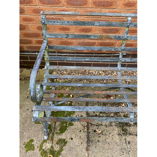 230 - A heavy wrought iron bench.