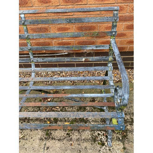 230 - A heavy wrought iron bench.