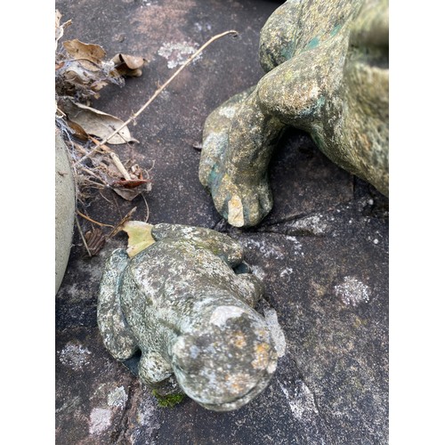 232 - A mixture of reconstituted stone and terracotta animals to include cats, dog and frogs. Dog 50cm h.