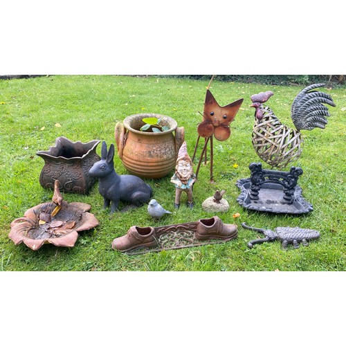 220 - A miscellany of garden ornaments to include cast iron planter, bird bath, boot scraper, cast iron gn... 