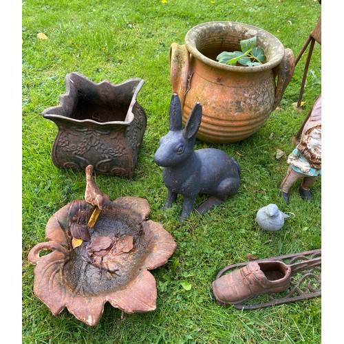 220 - A miscellany of garden ornaments to include cast iron planter, bird bath, boot scraper, cast iron gn... 