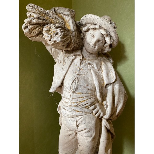 223 - A reconstituted stone figure of a man carrying sheaves of corn. 79cm h.