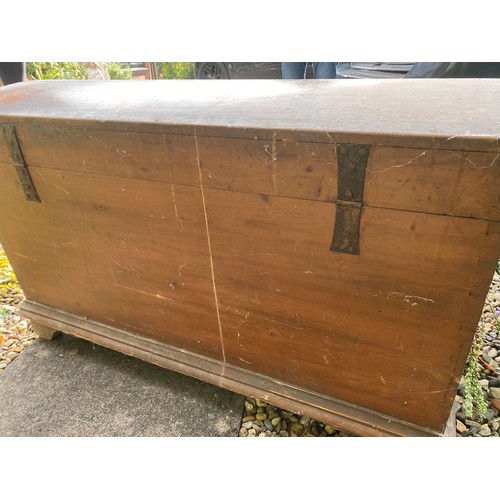 124 - A pine blanket box with interior candle box. Domed top and metal handles. 98.5 w x 55 d x 59cm h.