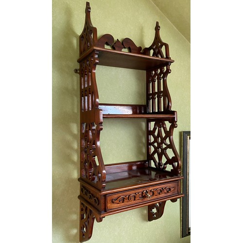 127 - A decorative wall shelf with drawer to base and fretted sides. 84 h x 34 w x 19cm d.