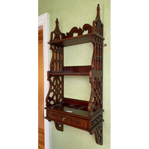 127 - A decorative wall shelf with drawer to base and fretted sides. 84 h x 34 w x 19cm d.