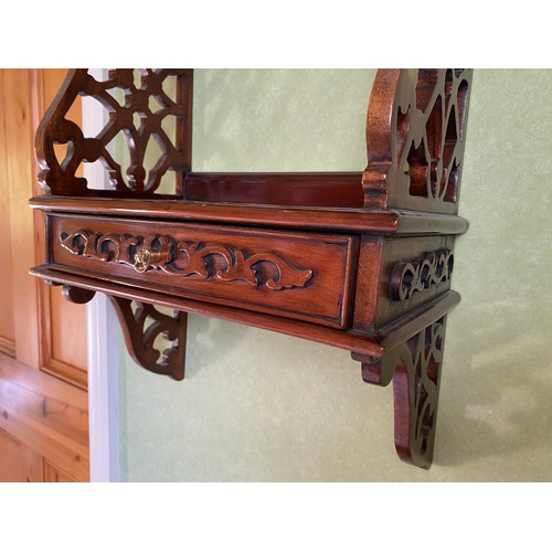 127 - A decorative wall shelf with drawer to base and fretted sides. 84 h x 34 w x 19cm d.