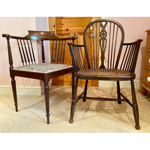 129 - An Edwardian inlaid corner chair and a cane seated wheel back chair.