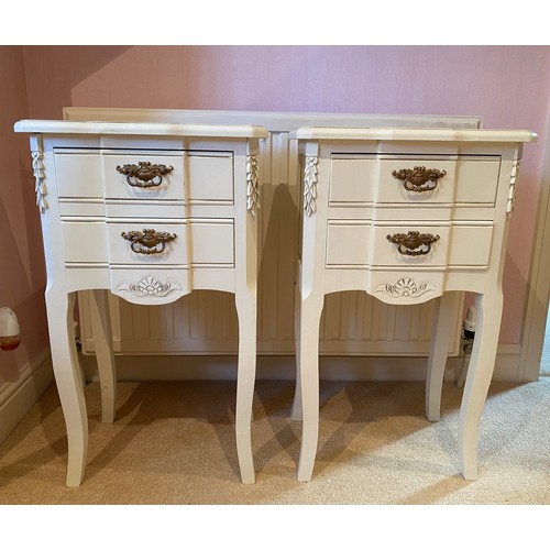 133 - A pair of cream painted two drawer bedside units with brass drop handles. 66cm h x 40cm w x 28.5cm d... 