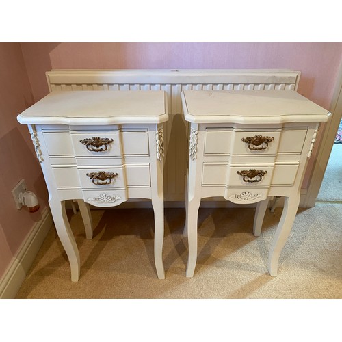 133 - A pair of cream painted two drawer bedside units with brass drop handles. 66cm h x 40cm w x 28.5cm d... 