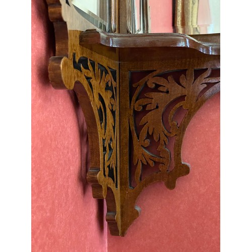 151 - A decorative mahogany 3 shelf corner shelf unit with bevelled glass panels. 96cm h approx.