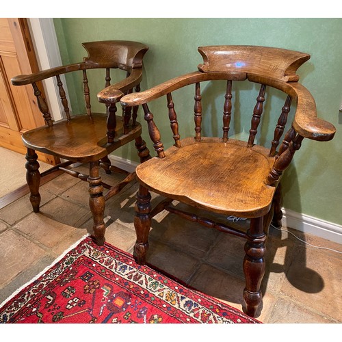 153 - Two oak captains chairs stamped W.L 150. 82cm h to back.