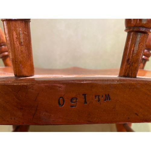 153 - Two oak captains chairs stamped W.L 150. 82cm h to back.