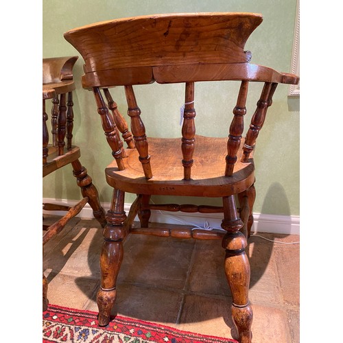 153 - Two oak captains chairs stamped W.L 150. 82cm h to back.