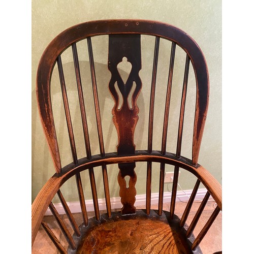 154 - A 19thC high backed Windsor armchair.