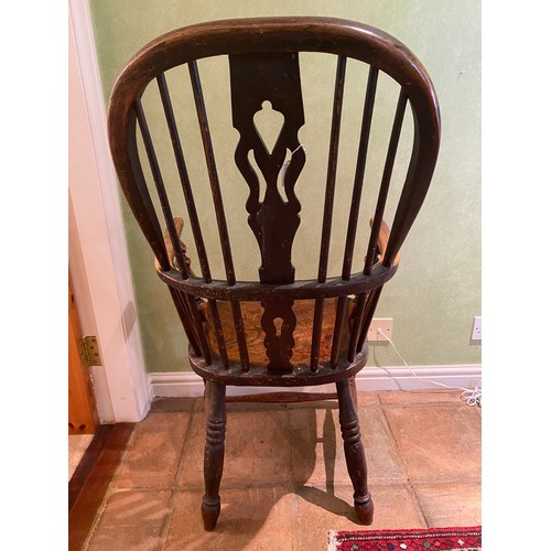 154 - A 19thC high backed Windsor armchair.