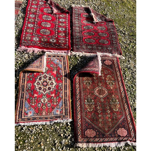 1214 - Four rugs to include a genuine Pakistan hand knotted wool pile. 98 x 59cm, 78 x 52cm, 97 x 62cm d, 8... 