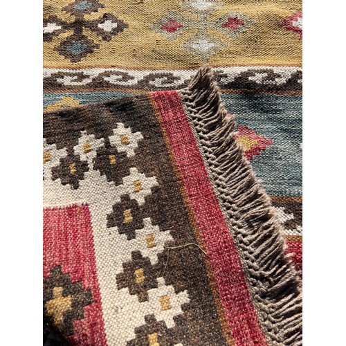 1216 - A Kilim style rug. 236 x 178.