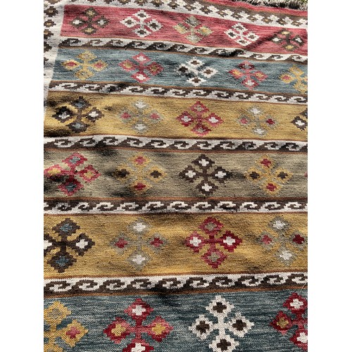 1216 - A Kilim style rug. 236 x 178.