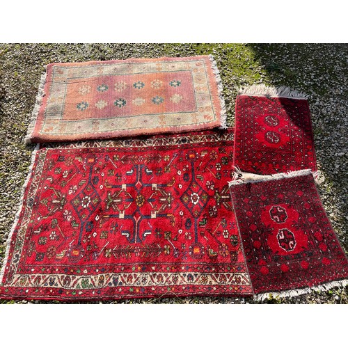 1218 - A selection of 4 rugs, largest rug including tassels 145 x 106cm.