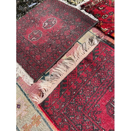 1218 - A selection of 4 rugs, largest rug including tassels 145 x 106cm.