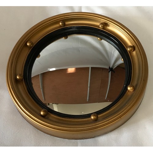 1132 - Two Convex wall mirrors with black inner trim largest 37.5cm diameter, smallest 27cm diameter.