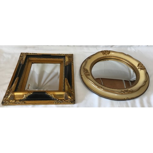 1133 - Two vintage mirrors one oblong 43 x 38cm with black and gilt trim and one round 44cm diameter