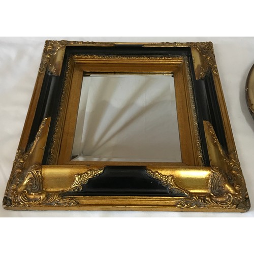 1133 - Two vintage mirrors one oblong 43 x 38cm with black and gilt trim and one round 44cm diameter