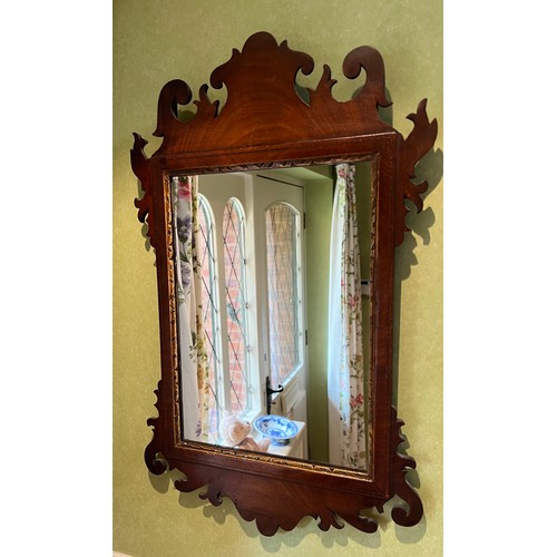 1141 - A small mahogany fretted wall mirror. 59.5 h x 36.5cm w.