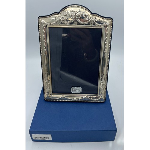 777 - Silver photograph frame, Sheffield 1997 unused in original box 24 x 16.5cm.