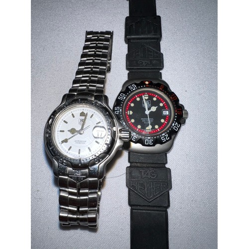 963 - Two Tag Heuer Professional watches, one with black dial.