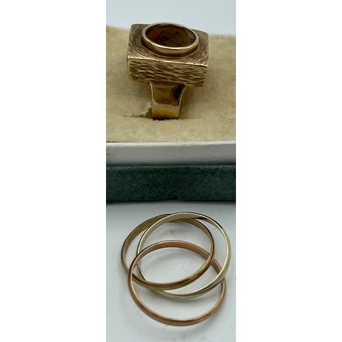 618 - Two 9 carat gold rings, one set with yellow stone and one puzzle ring. Total weight 7.7gm. Size P an... 