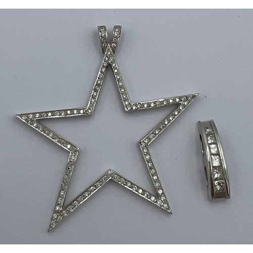 621 - Two 18 carat white gold pendants set with diamonds. Star 4cm diameter. Total weight 7.6gm.