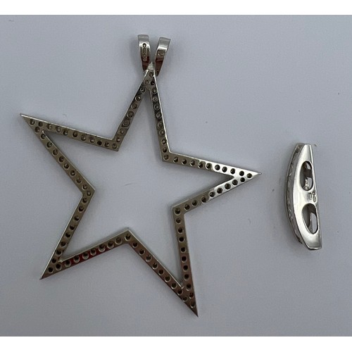 621 - Two 18 carat white gold pendants set with diamonds. Star 4cm diameter. Total weight 7.6gm.